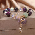 Purple Tigereye money bag pendant transport bracelet with crystal and rhinestone details