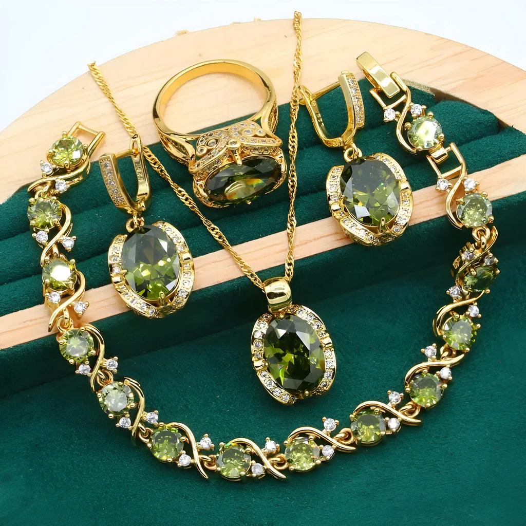 Olive green and red zircon jewellery set for women featuring a necklace with snake bone chain, matching earrings, and a ring.