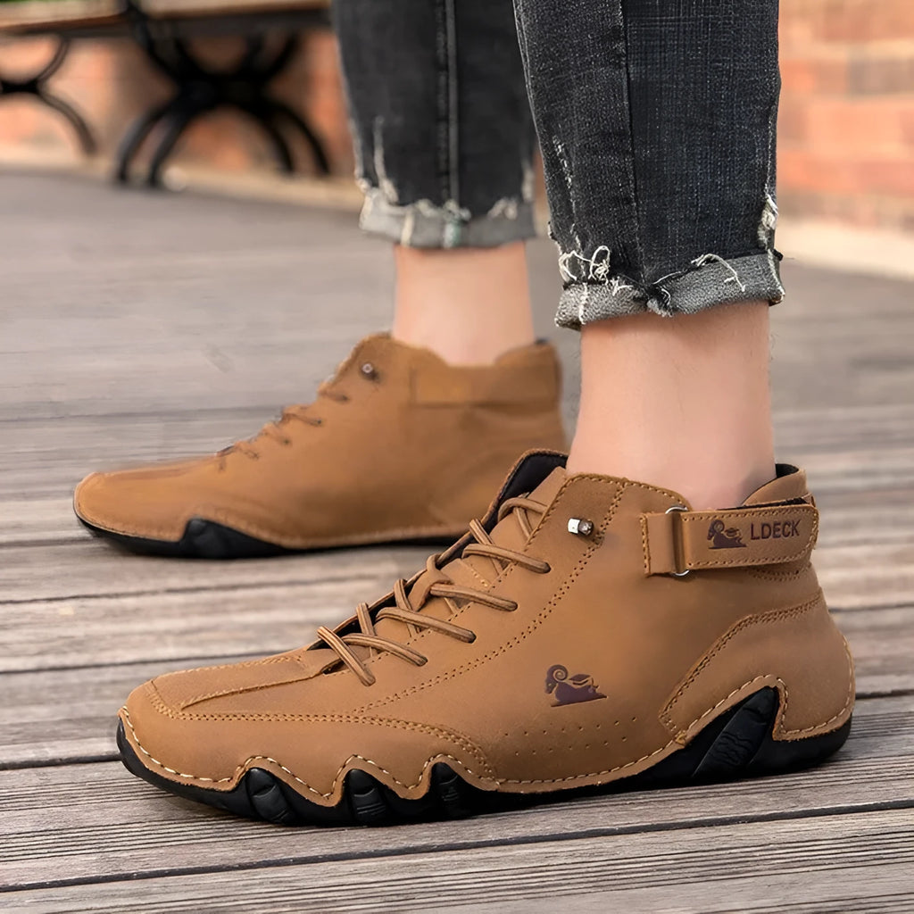 Men's khaki high top boots with octopus design, rubber sole, and pigskin ankle collar.
