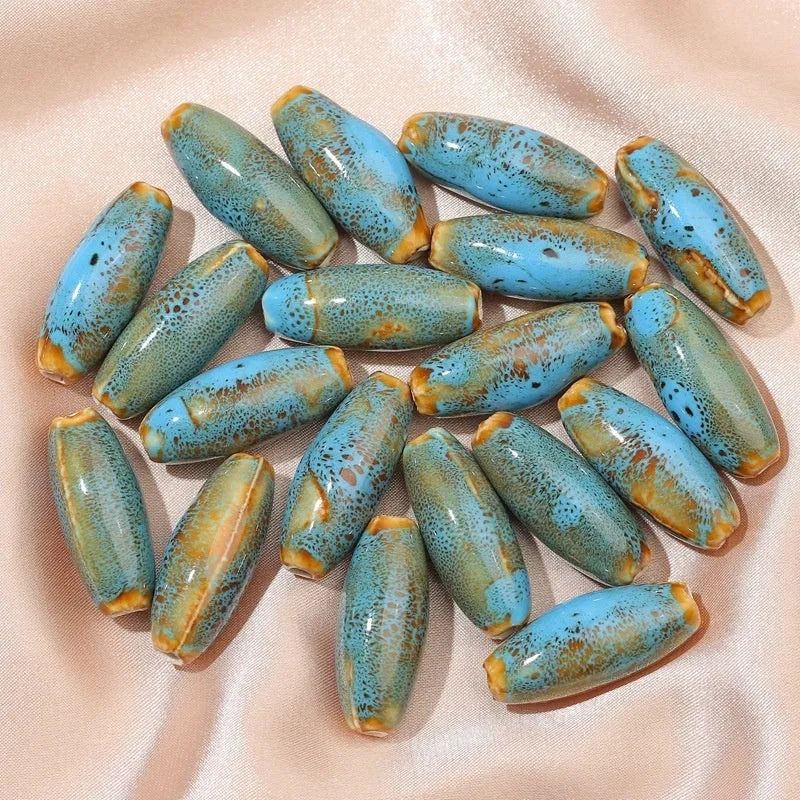 Ceramic bullet beads in seven colours for jewellery making and bracelet braiding
