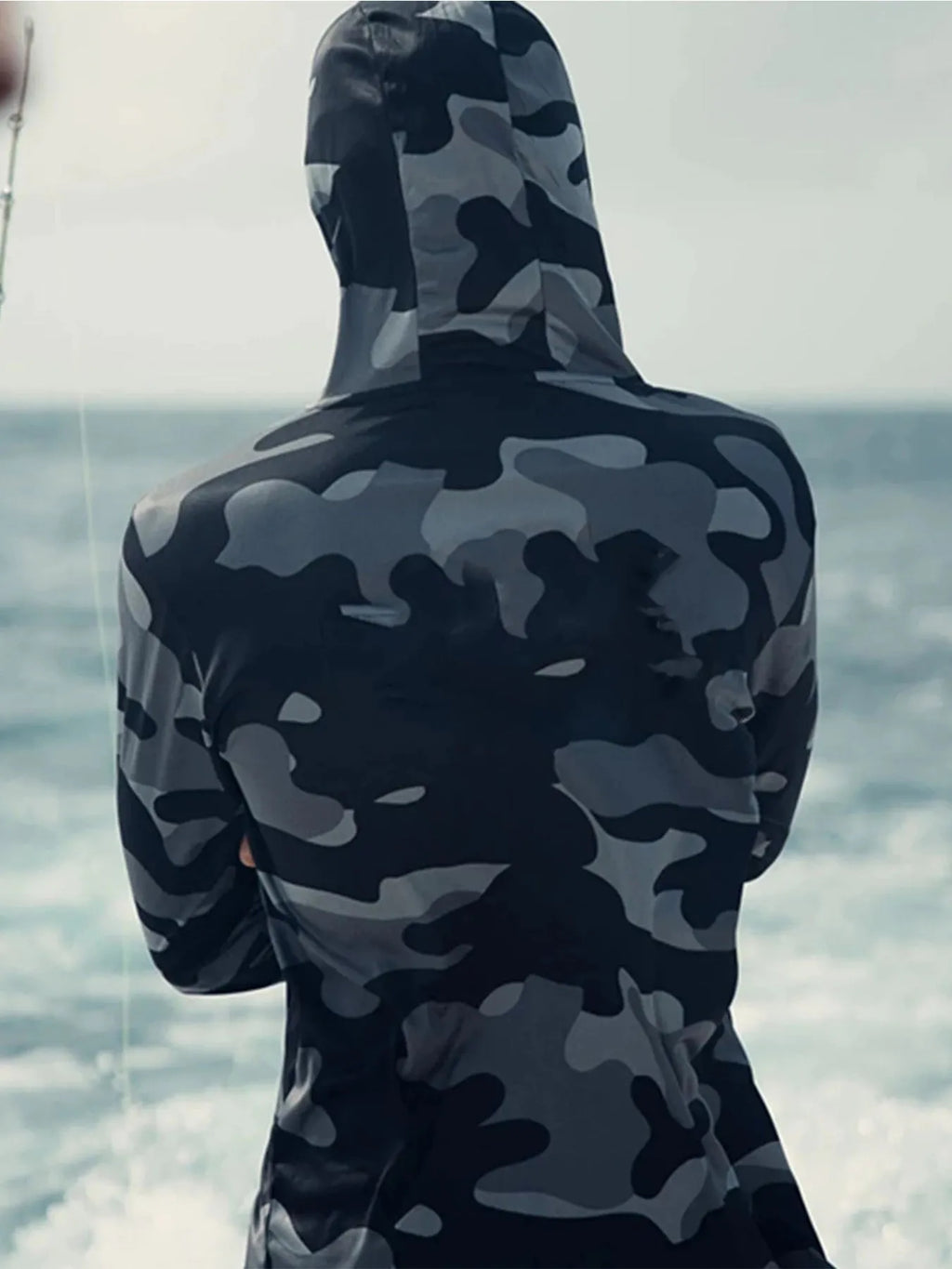 Men's grey fishing hoodie with long sleeves, mesh side panels, and crew neck design for outdoor sun protection