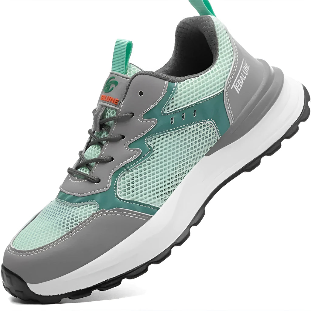 Green low-top work safety shoes with plastic toe cap, mesh upper panels, and slipper-style closure