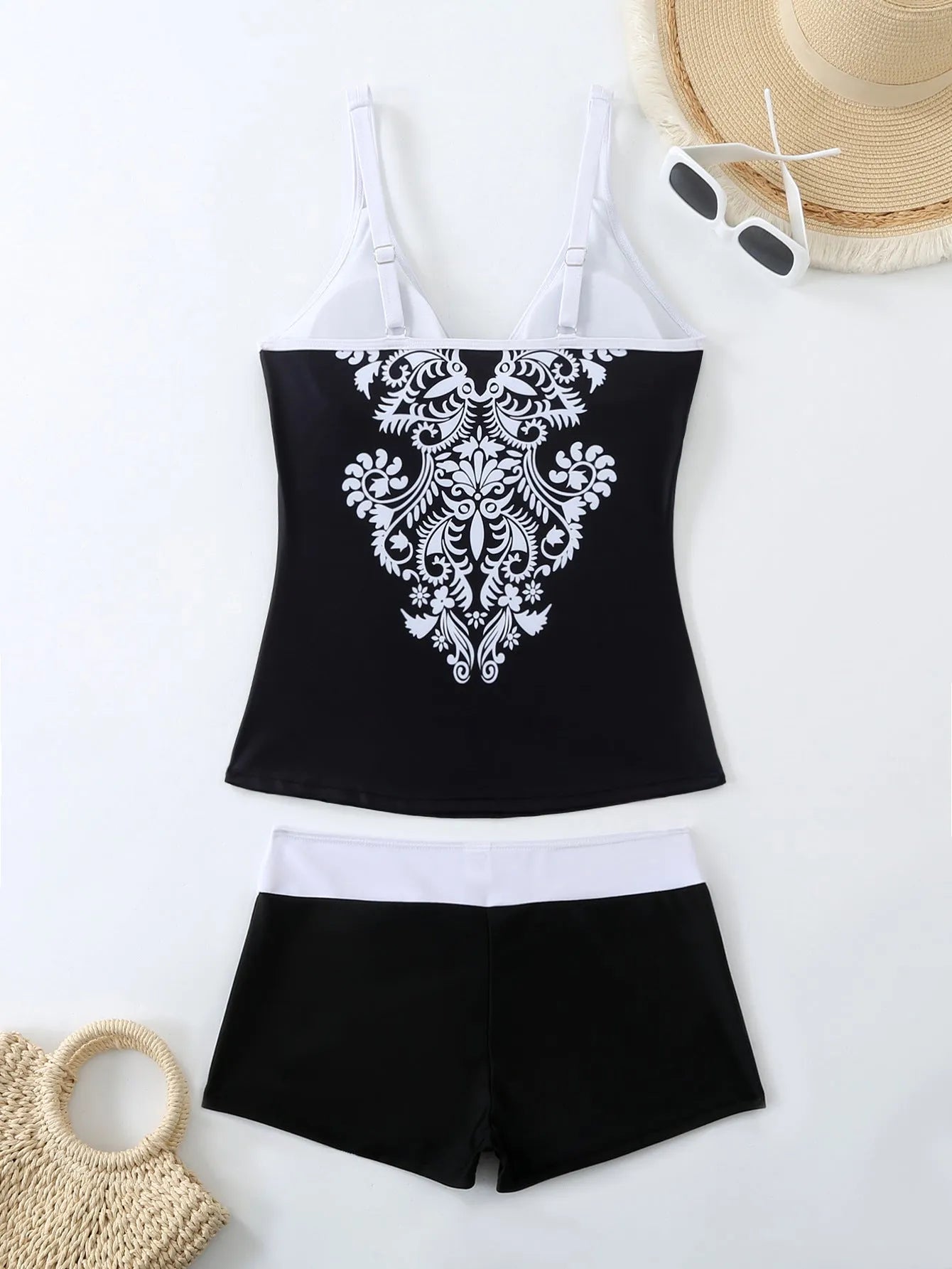 Plus size women's two-piece swimsuit briefs in black or rose red, made from polyester with cotton lining.