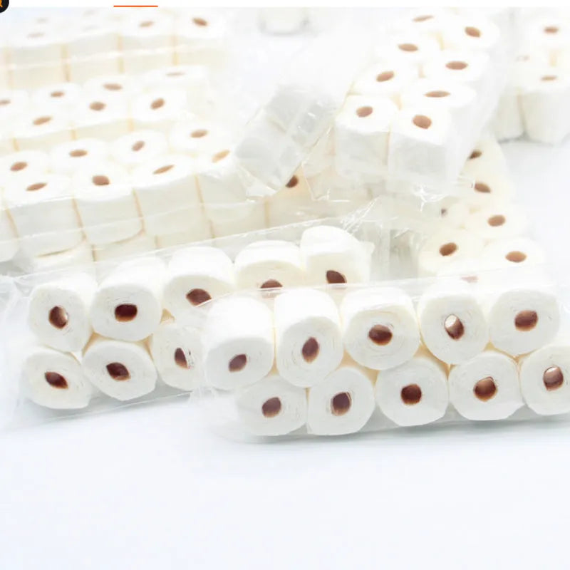 Miniature simulated toilet paper roll toy model for dollhouses, made of paper.