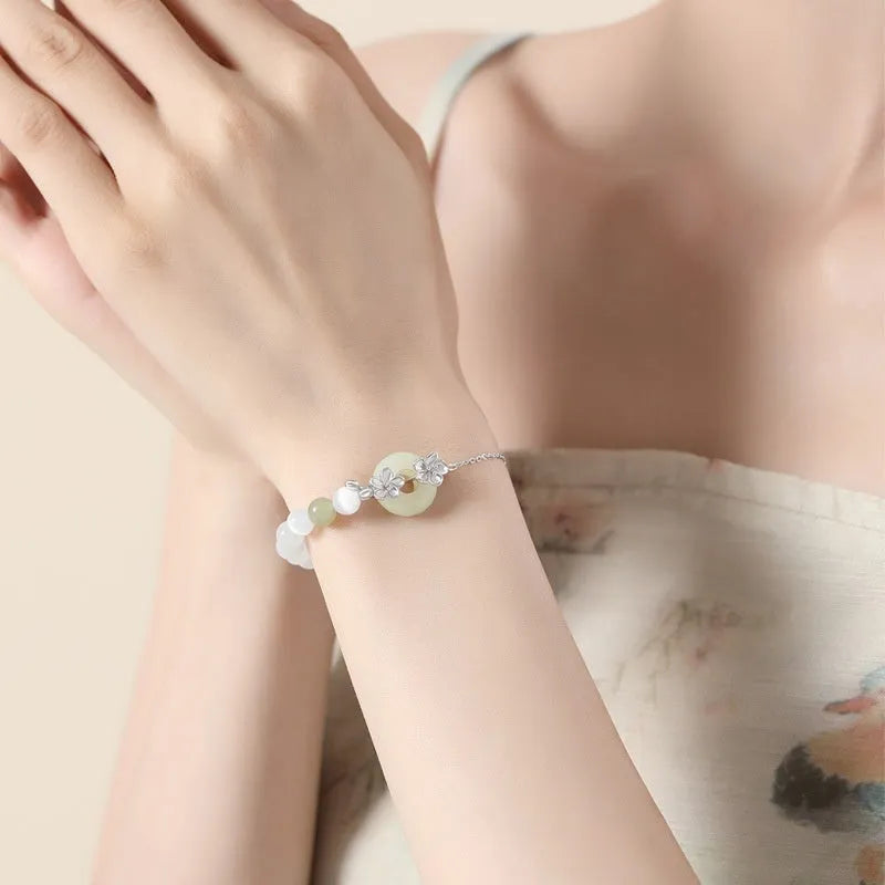 Silver peach blossom charm bracelet with peace buckle closure in New Chinese style