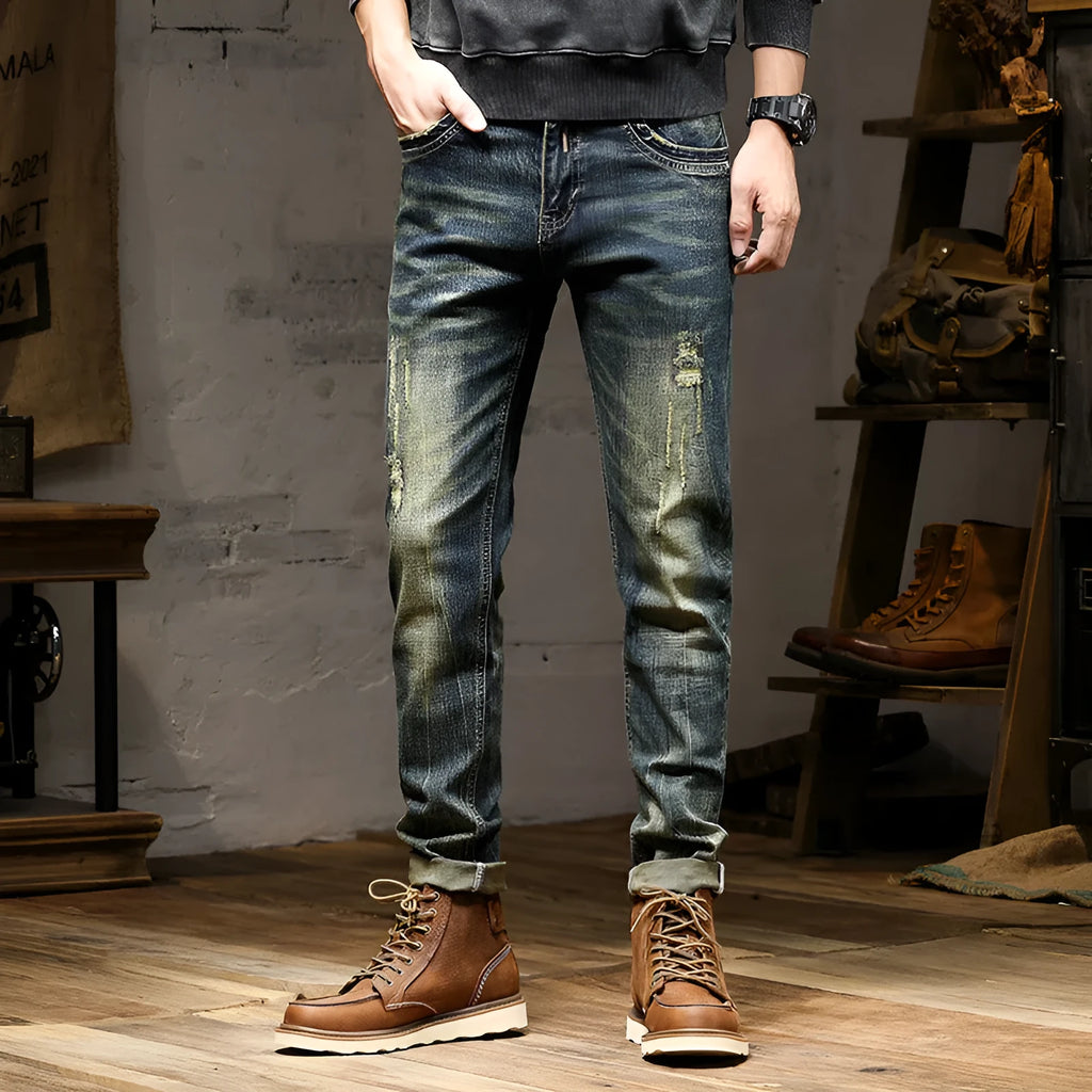 Men's skinny fit jeans in a retro blue wash with a zip fly closure.