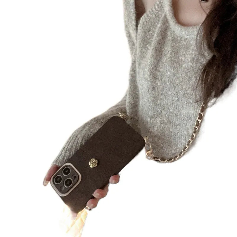 Maillard classic camellia phone case in brown with embossed pattern and adjustable crossbody strap