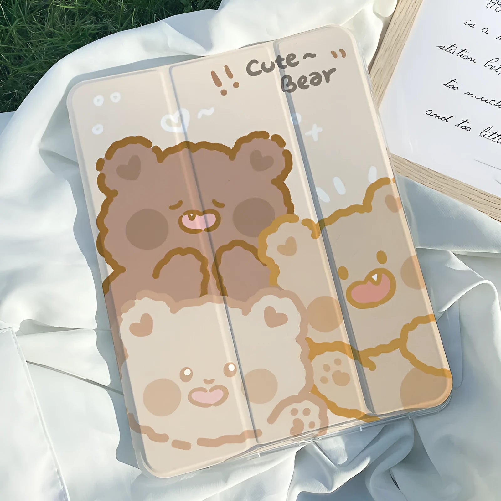 Silicone tri-fold iPad protective case with cartoon cat design, shown in stand mode.