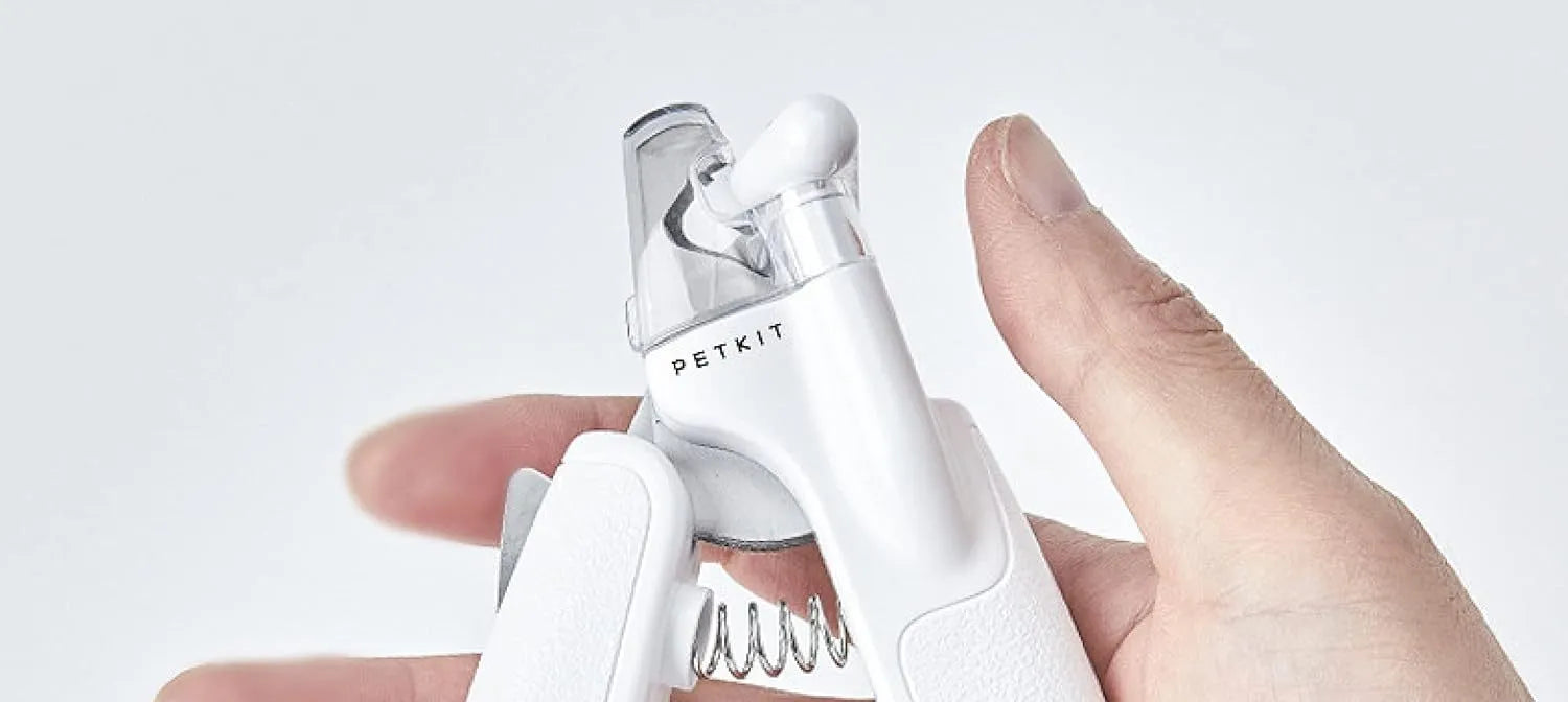 White LED pet nail clippers for cats and dogs with open transparent safety guard and nail file.