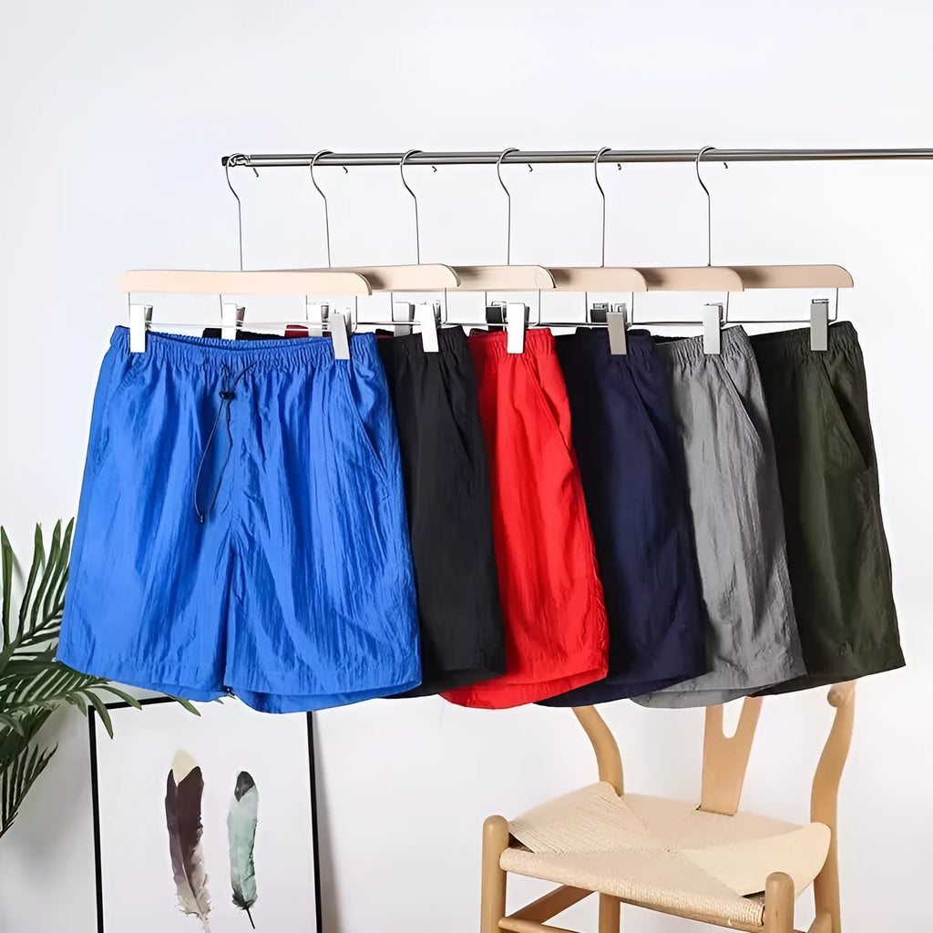 Men's quick-drying straight-leg sports shorts in army green, shown flat.