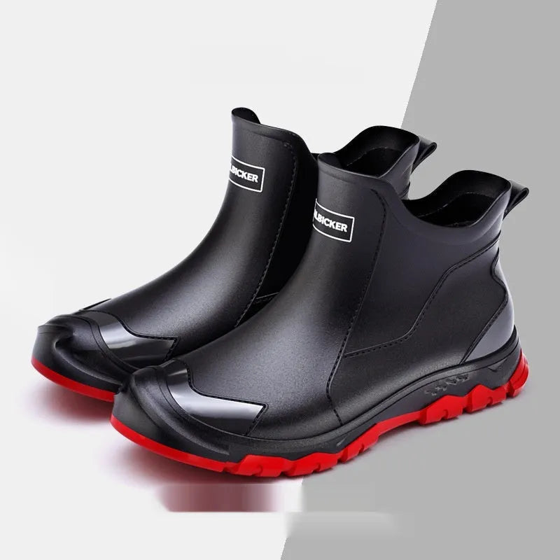 Short tube PVC rain boot in black and red with round toe and flat non-slip sole.