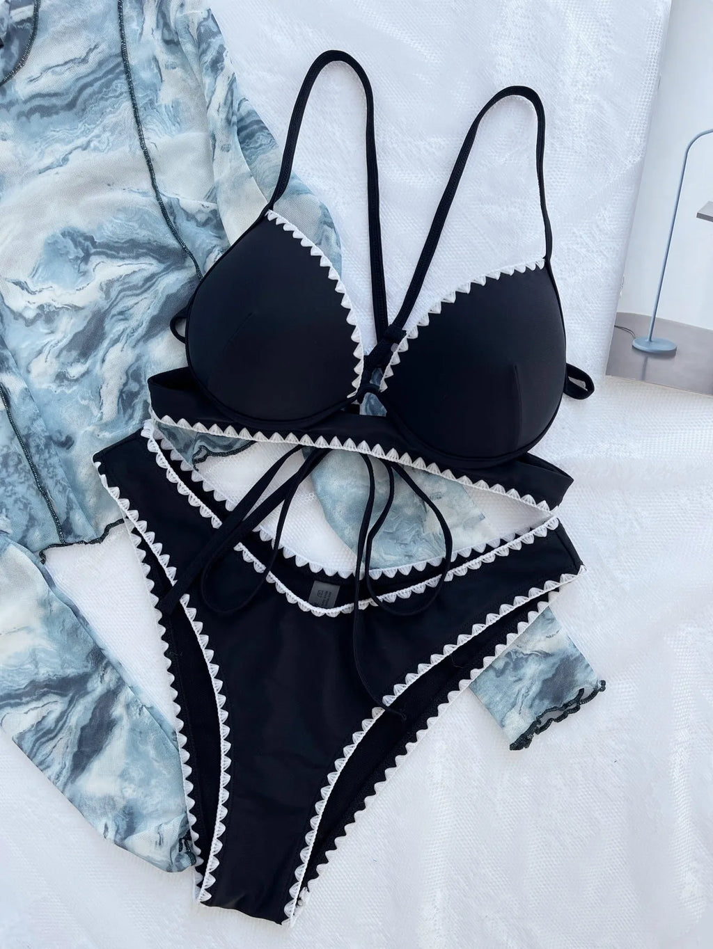 Women's black split bikini swimsuit made from nylon fabric, available in sizes S M L