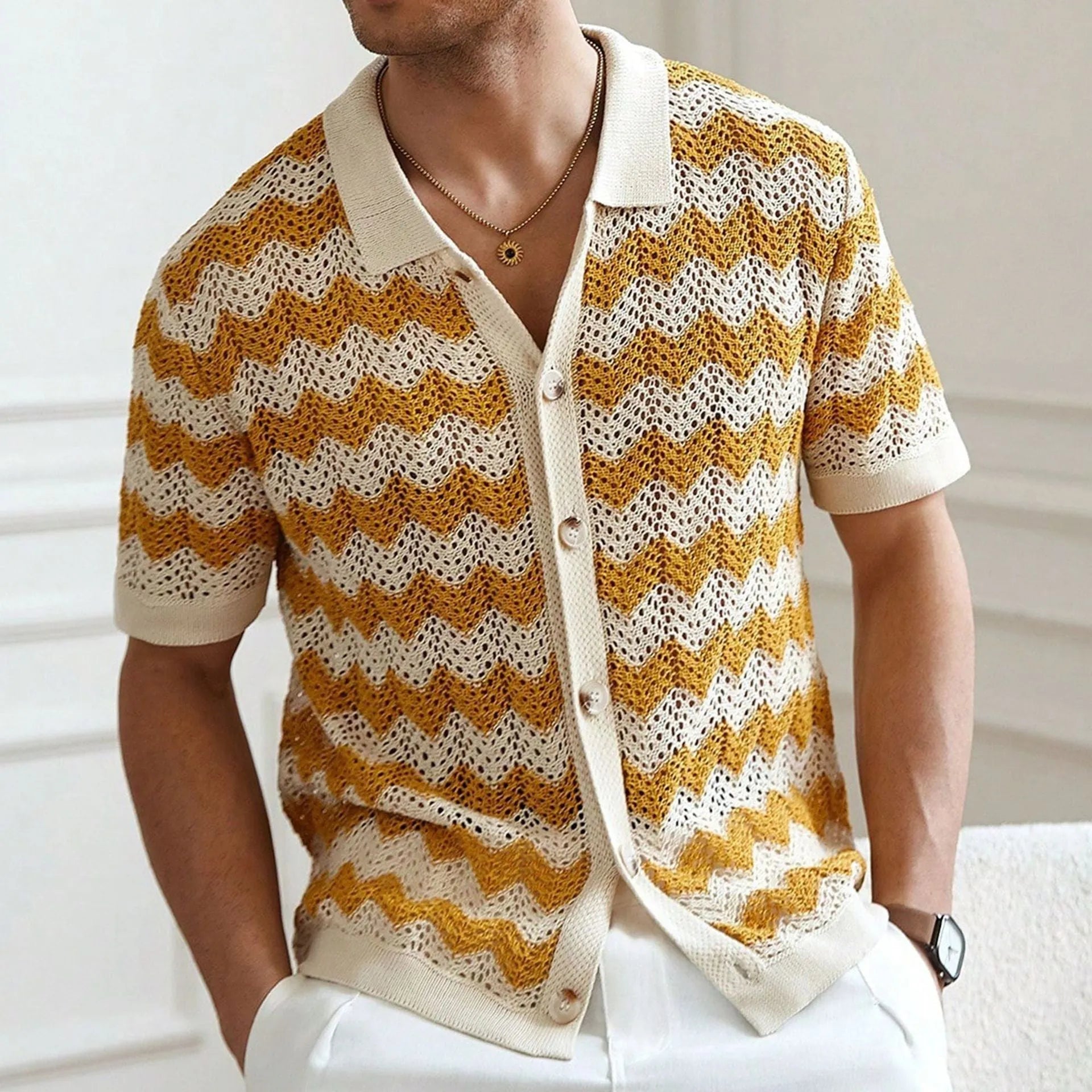 Short sleeve corrugated Tencel sweater with a blue hollow jacquard texture on a hanger.