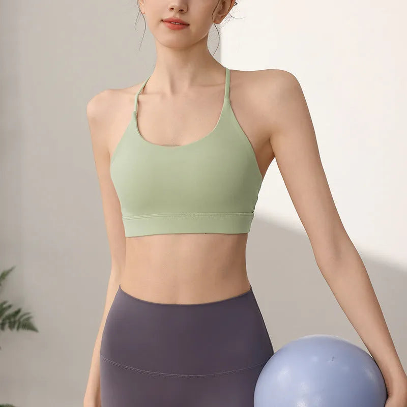 Women's nylon sports vest with fixed double shoulder straps in multiple colours.