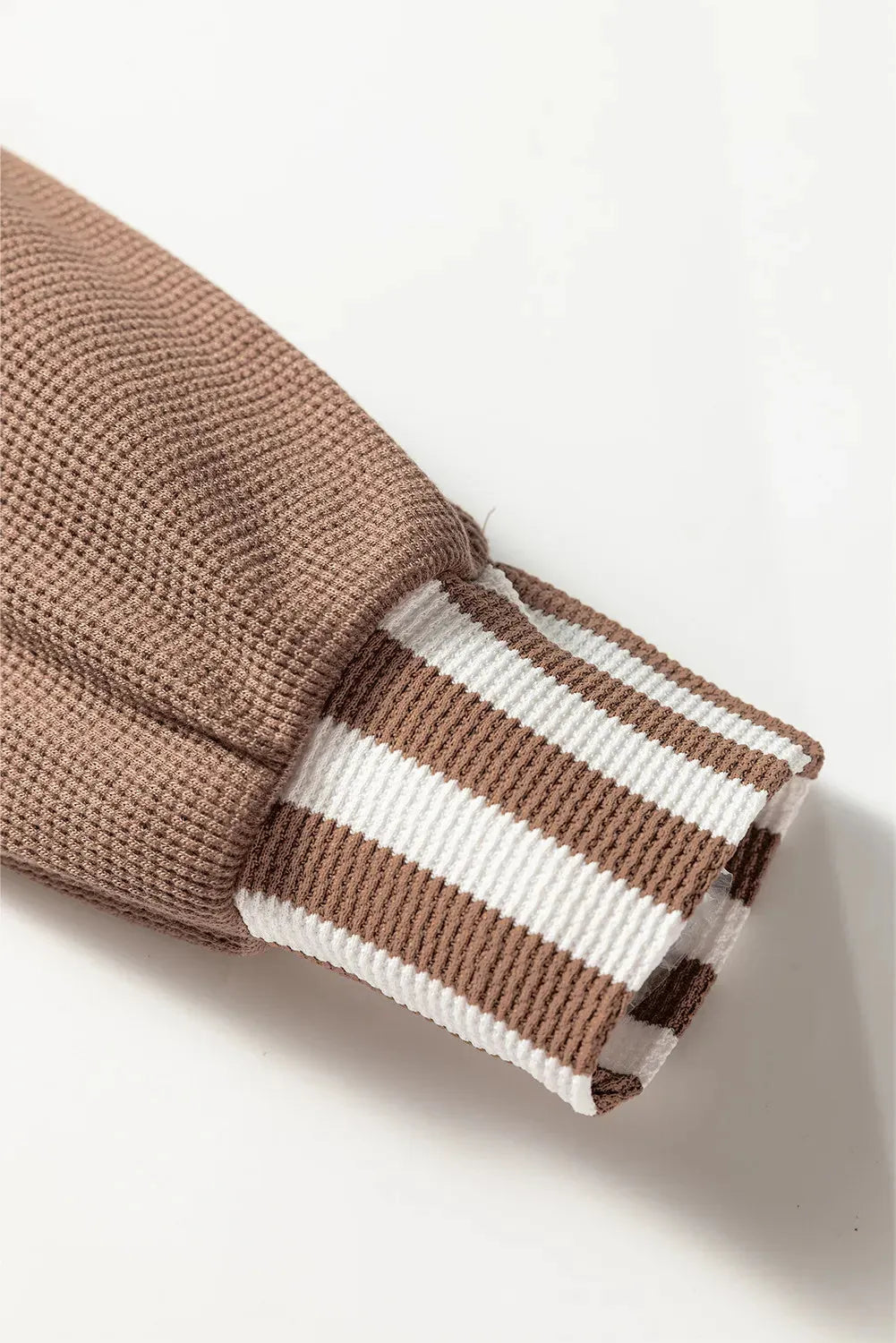 Straw yellow waffle texture striped patchwork hoodie with a button neck and drawstring hood.