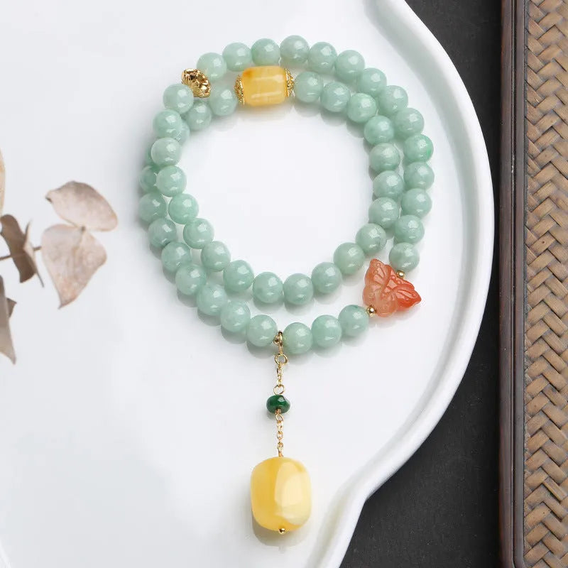 Double-layer women's bracelet with jade round beads and beeswax barrel beads in geometric hanging design
