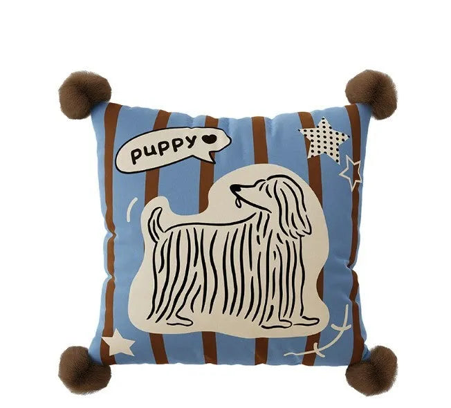 Cartoon printed cushion pillow with cute animal design on a sofa, showing blue colour and square shape.