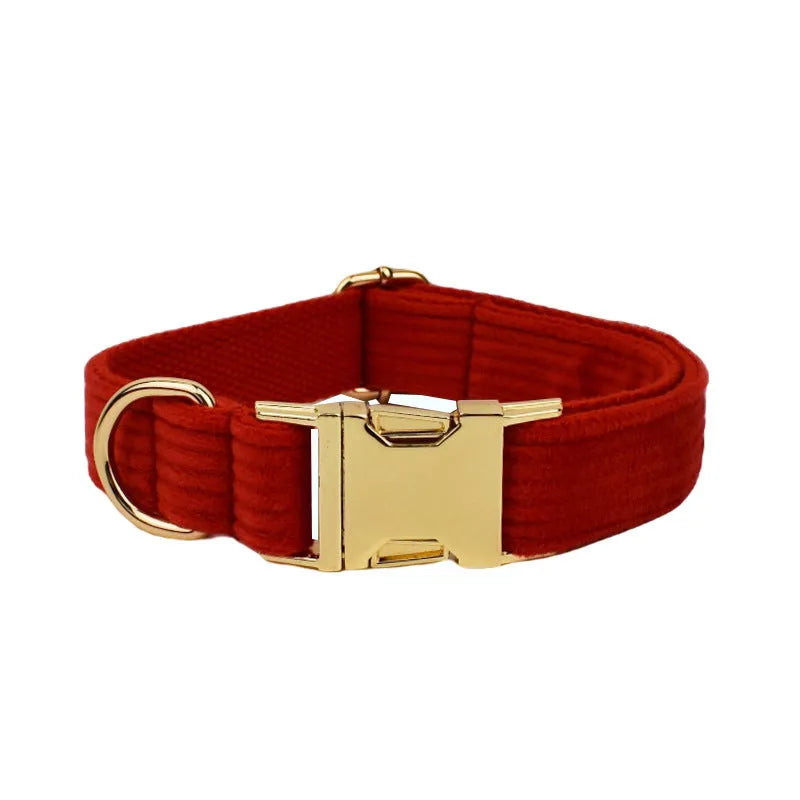 Red corduroy dog collar and matching traction rope set with vest, bow, and poop bag accessories
