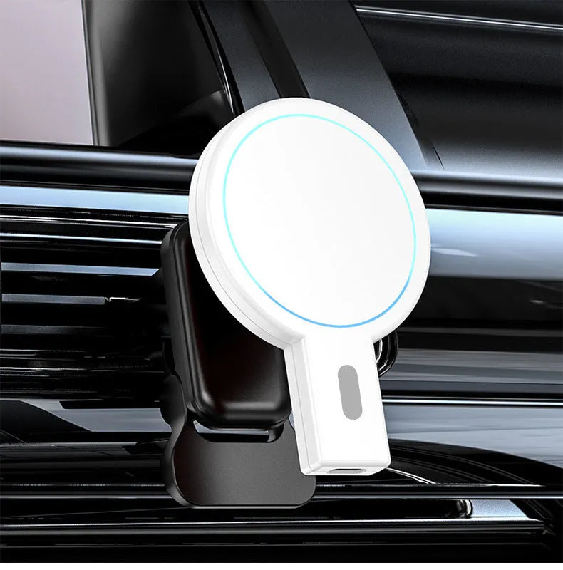 White magnetic wireless phone charger on desk with mobile phone attached