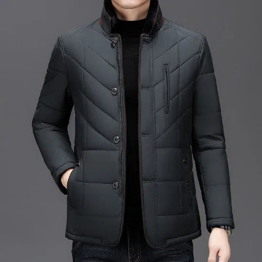 Men's dark blue winter short cotton-padded coat with side seam pockets.