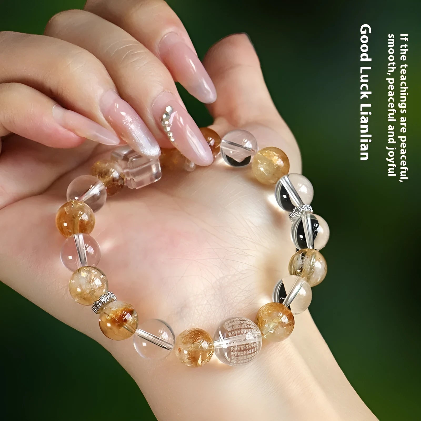Handmade women's bracelet with white crystal beads, freshwater pearls, and yellow crystal accents