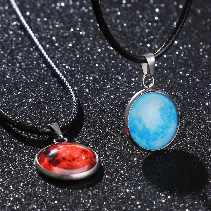 Luminous glass and coloured glaze constellation pendant necklace on an alloy chain with extension.