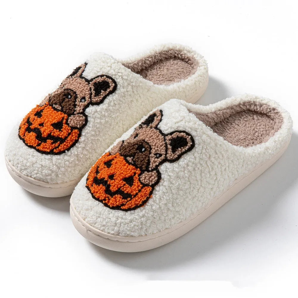 Black and white Halloween pumpkin plush house slippers with non-slip rubber soles.