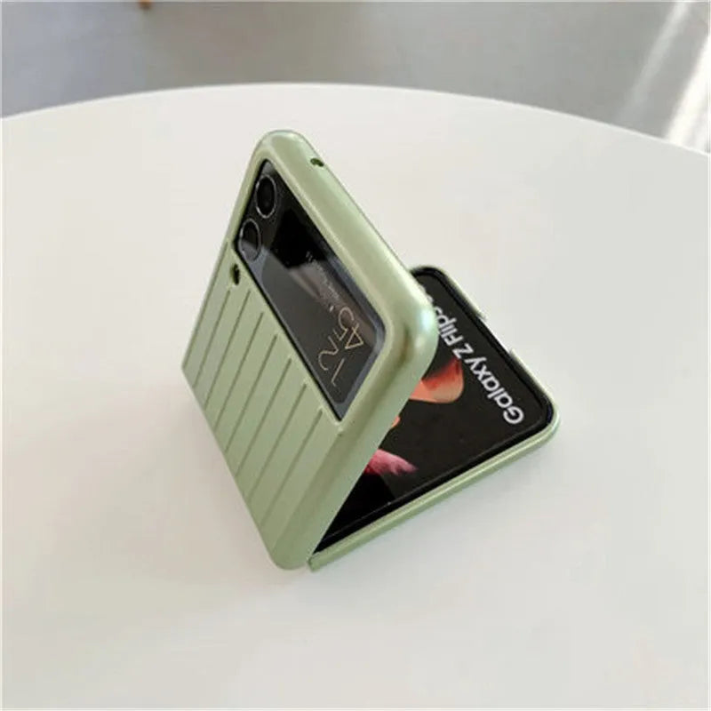 Ultra-thin black flip phone case for Samsung Z Flip3 folding mobile on a plain background.
