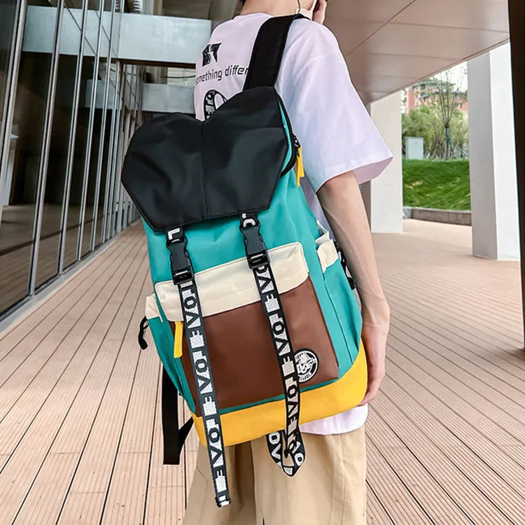 Oxford cloth school backpack showing black, green and red colour options with handheld and shoulder straps