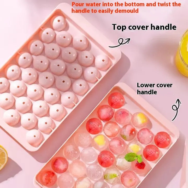 Blue silicone ice cube tray with lid showing 33 round cavities.