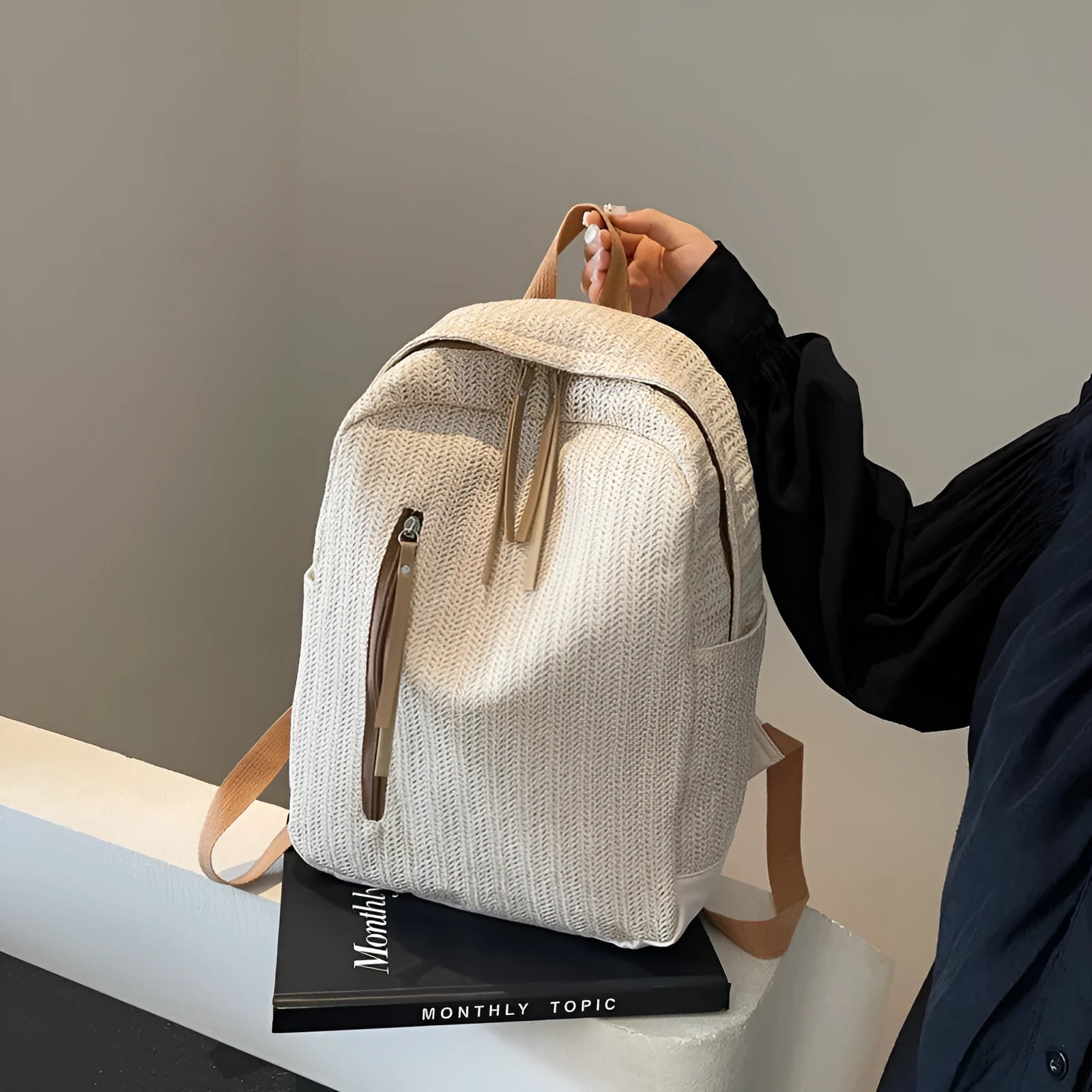Minimalist waterproof polyester backpack in black with internal phone pocket and urban simplicity design