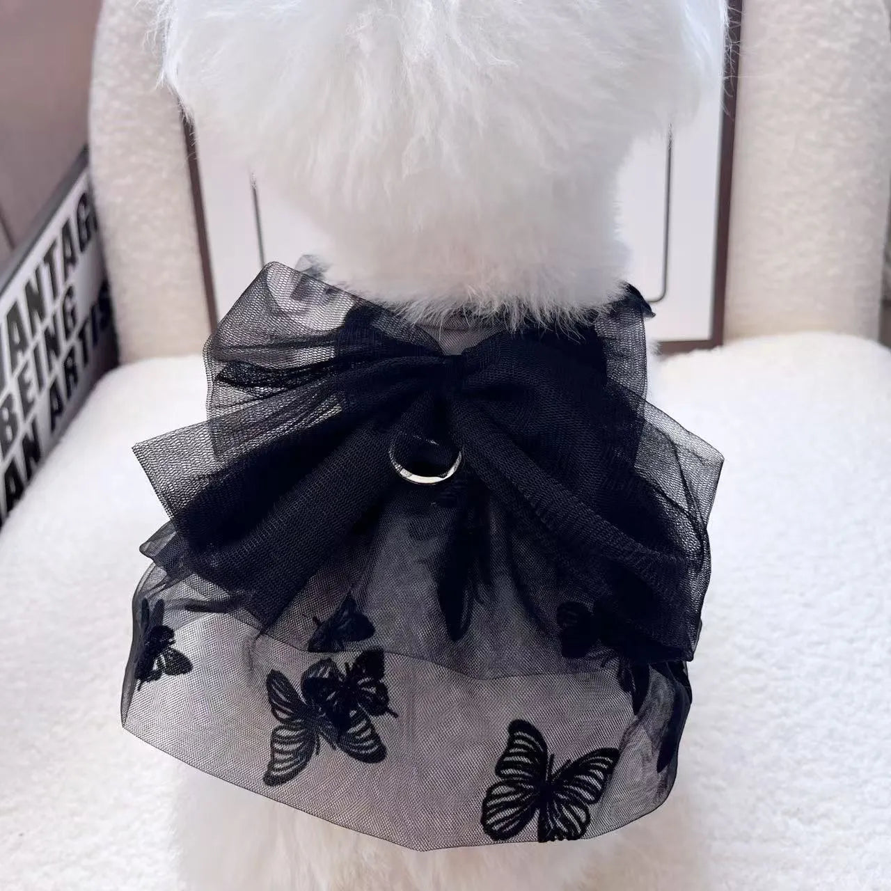 Black gauze princess tulle skirt for a dog or cat on a size chart.