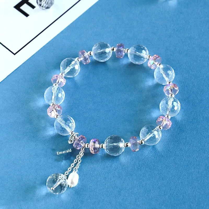 Women's white crystal bracelet with diamond-shaped beads and lucky cat charm