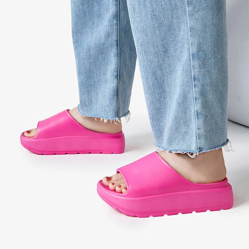 Women's thick-soled beige EVA beach slippers with a fish mouth design.