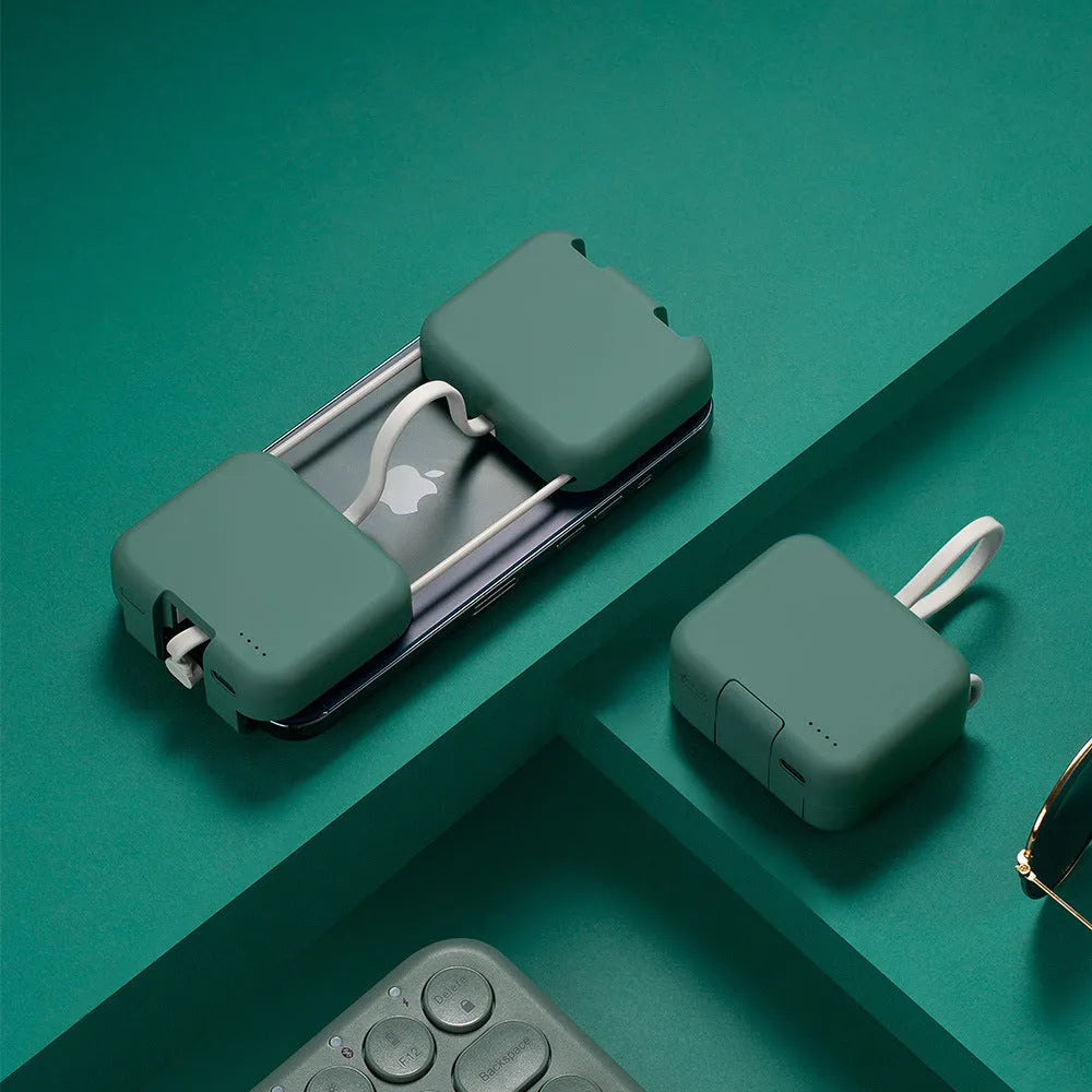 Red multi-function bracket mobile power supply showing USB-C and Lightning ports and integrated phone holder.