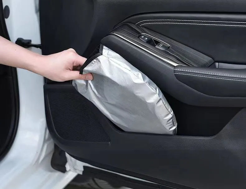 Titanium silver aluminium foil car sunshade folded, showing its reflective surface.