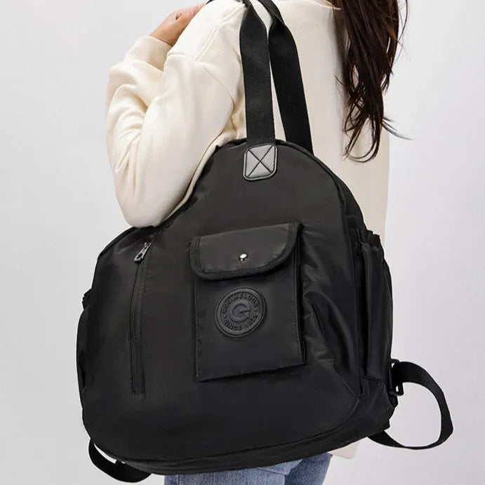Outdoor lightweight large capacity nylon backpack in black, shown with sandwich pocket detail.