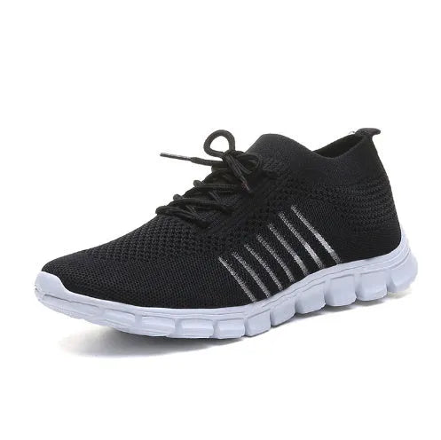 Women's breathable high-cut lace-up casual sneaker on a flat platform heel with a rubber sole.