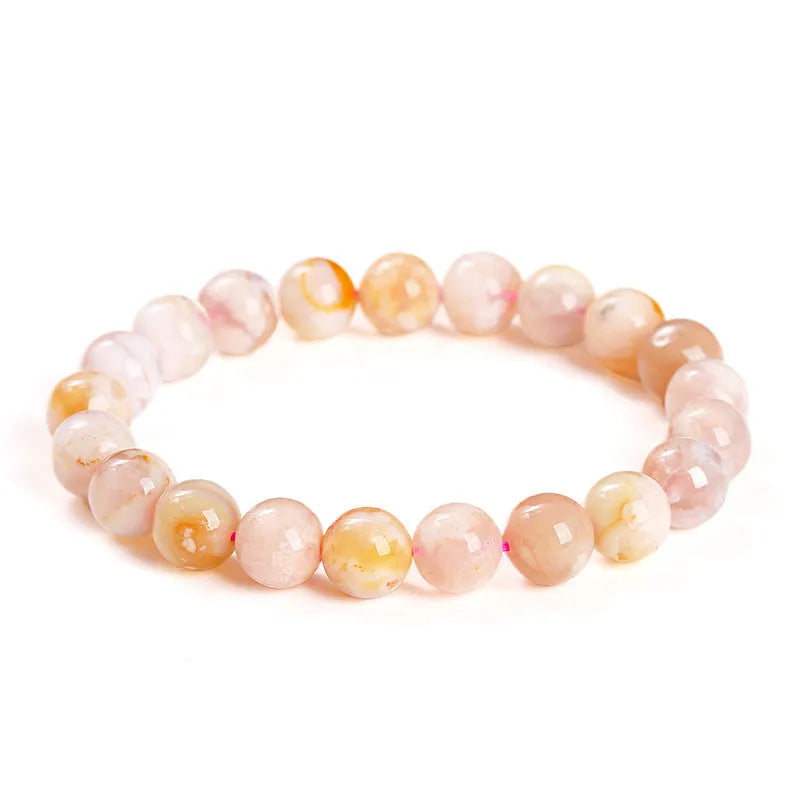 A sweet-style natural cherry agate bracelet with round geometric beads for women.