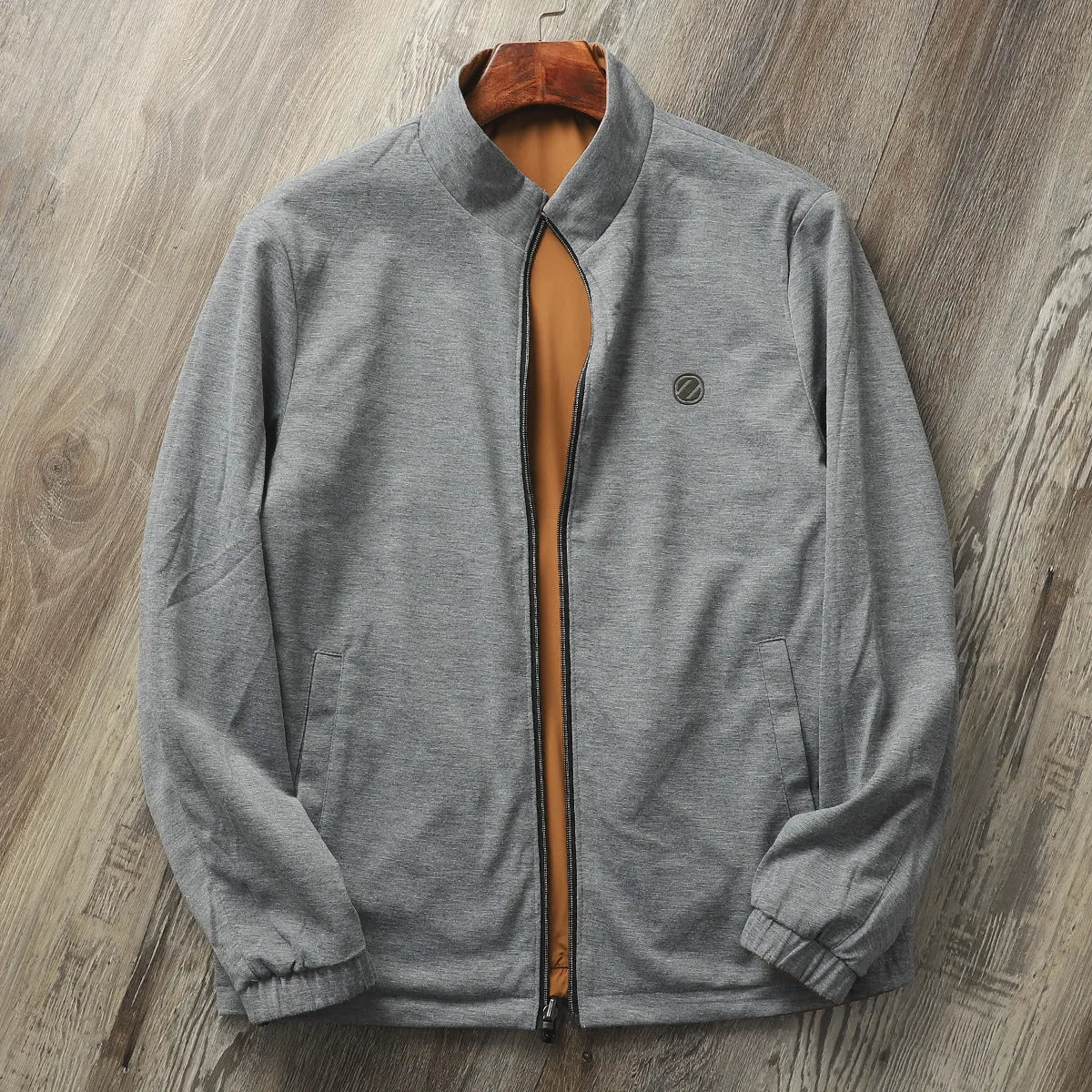 Men's simple stand collar casual jacket in a polyester blend fabric, shown in one of four available colours.