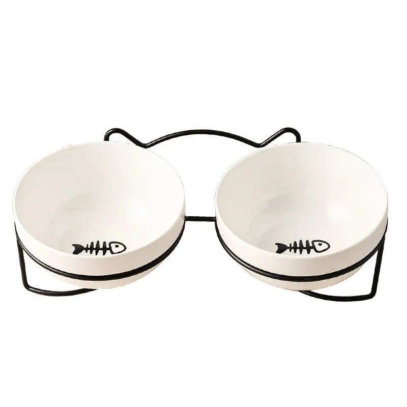 White ceramic cat bowl with cat paw pattern and black iron frame with cat ears