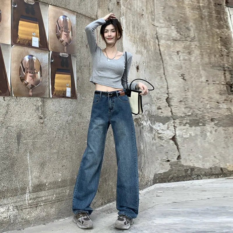 Women's high waist straight leg jeans in retro blue denim, shown on a model.