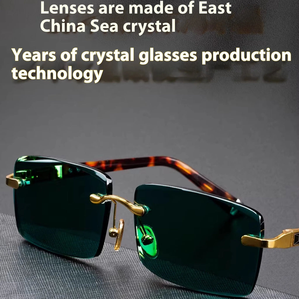 Frameless dark green sunglasses with a crystal aesthetic style, shown with a matching case and lens cloth.