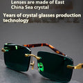 Frameless dark green crystal sunshade glasses with a glasses case and lens cloth