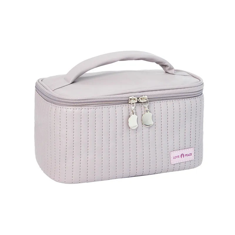 Open-top cake style women's makeup bag in PU leather showing solid colour options