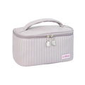 Open-top cake style women's makeup bag in PU leather showing solid colour options