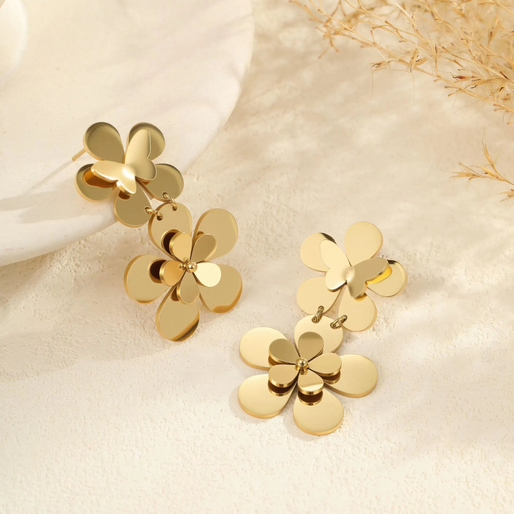 Gold flower butterfly earrings for women with geometric design on stainless steel.