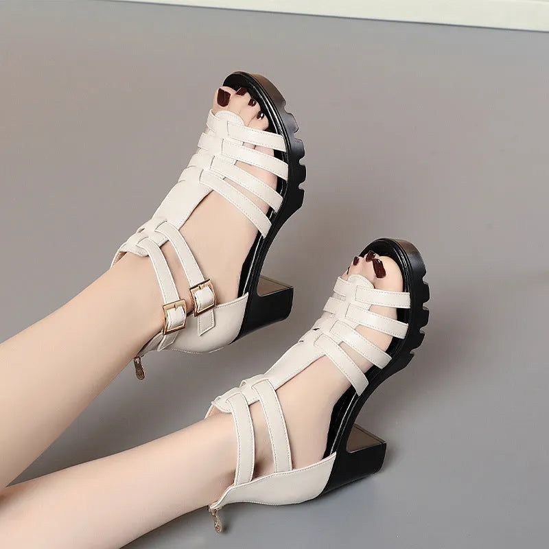 Women's beige high heels with hollow-out design, rhinestone details, and an ankle buckle strap.