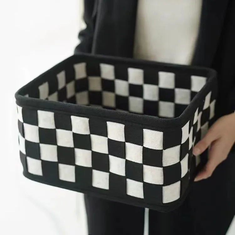 Checkerboard patterned woven felt folding storage basket with handle, showing dimensions 37cm by 29cm by 19.5cm.