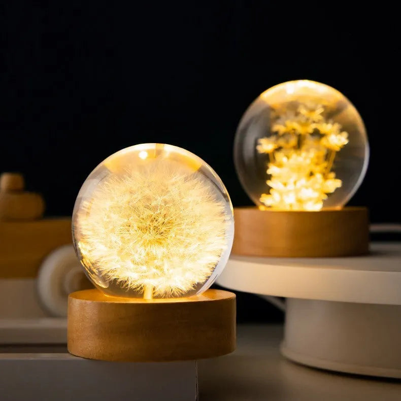 60mm dandelion crystal ball ornament with LED light on a beech wood desktop stand.
